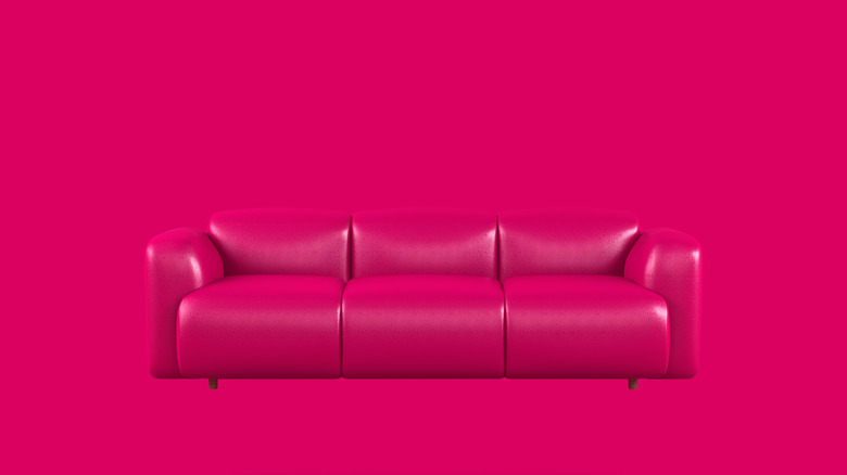 Bright pink couch on bright pink background