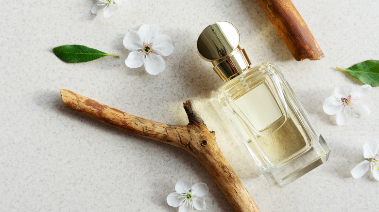Bottle of perfume with flowers 