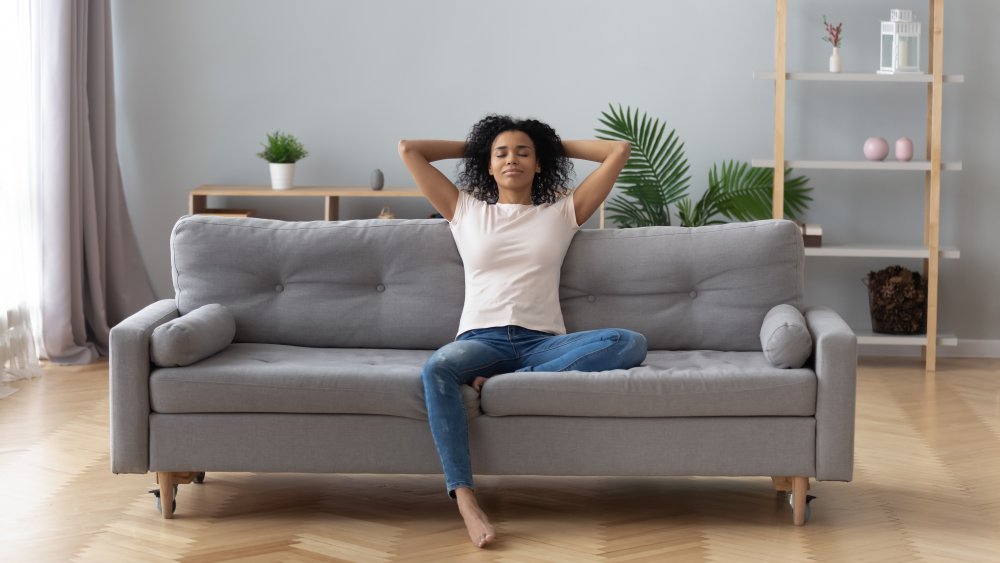 woman relaxing on couch