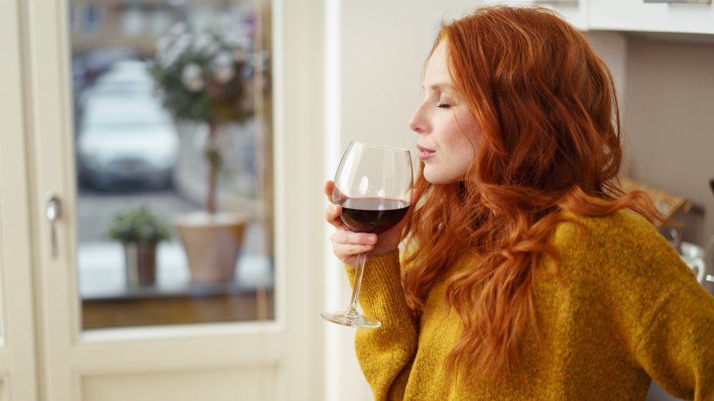 woman sipping wine glass