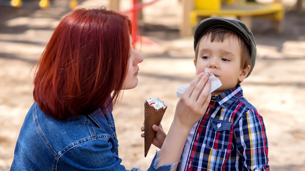 mom wiping kid's face