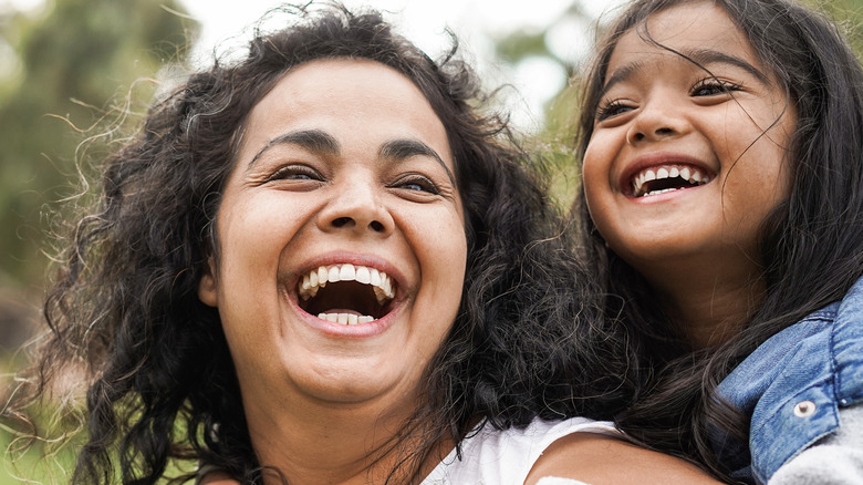 Woman smiling with child