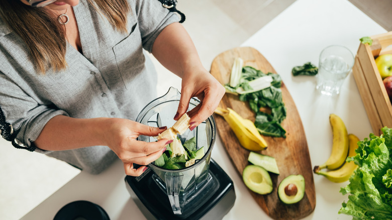 Woman making a smoothie