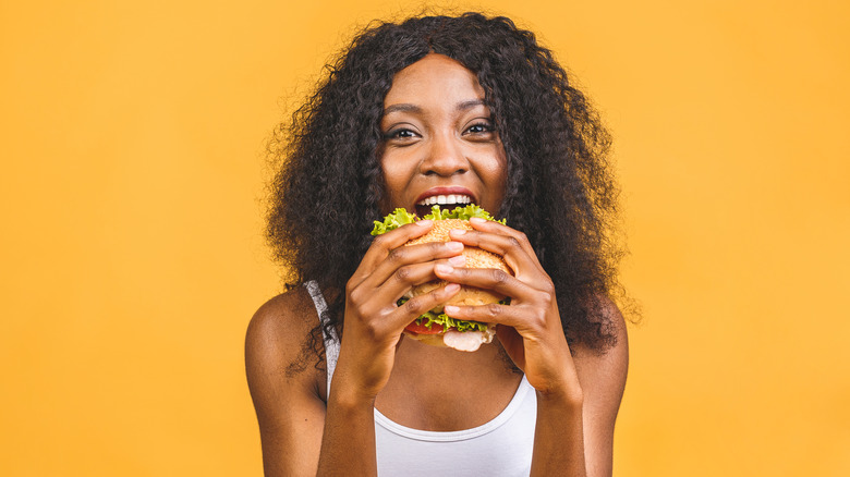 Woman eating burger 