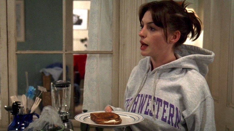 Anne Hathaway with a grilled cheese in The Devil Wears Prada