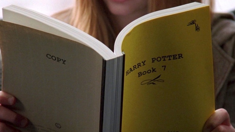 Close-up of one of the twins reading Harry Potter in The Devil Wears Prada