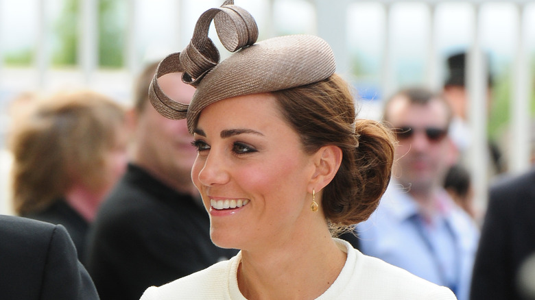 Kate Middleton smiling in a crowd