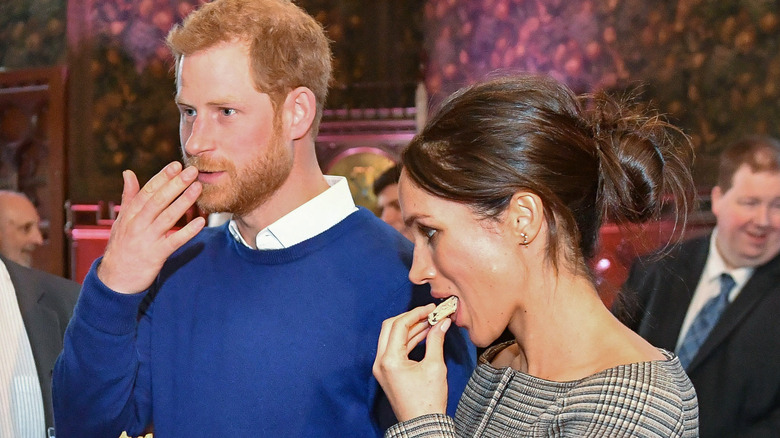 Prince Harry and Meghan Markle eating