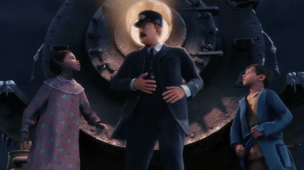 Girl, boy, and conductor in The Polar Express