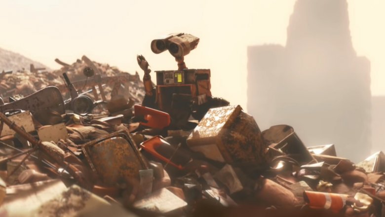 WALL-E looking at trash in WALL-E