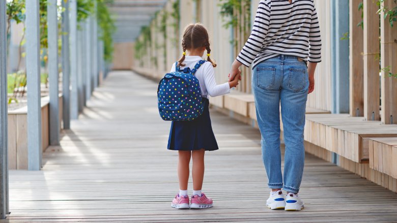 mom walking daughter to school