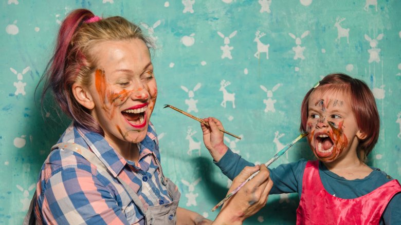 mom and daughter with patin on their faces