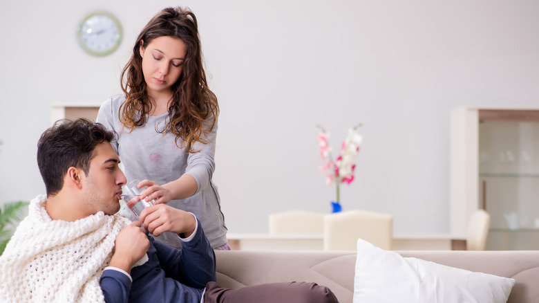 woman caring for sick husband