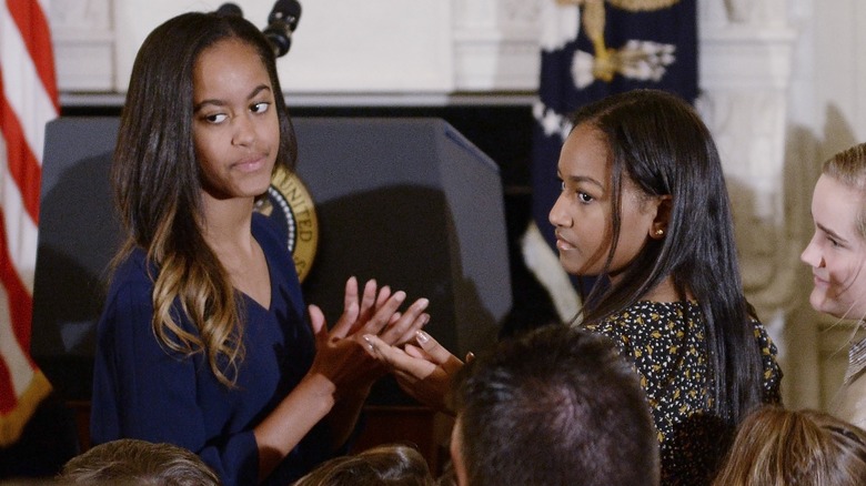 Sasha and Malia Obama looking back