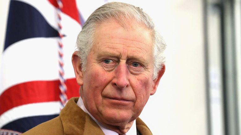 Prince Charles by the British flag