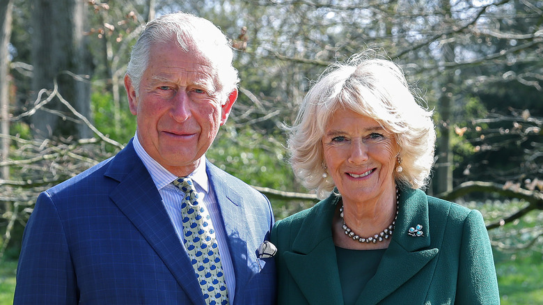 Charles, Camilla smiling outdoors