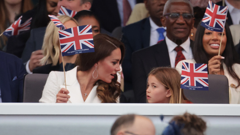 Kate Middleton Prince Charlotte waving flags