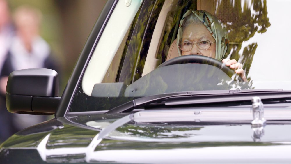 Queen Elizabeth  behind the wheel of a car