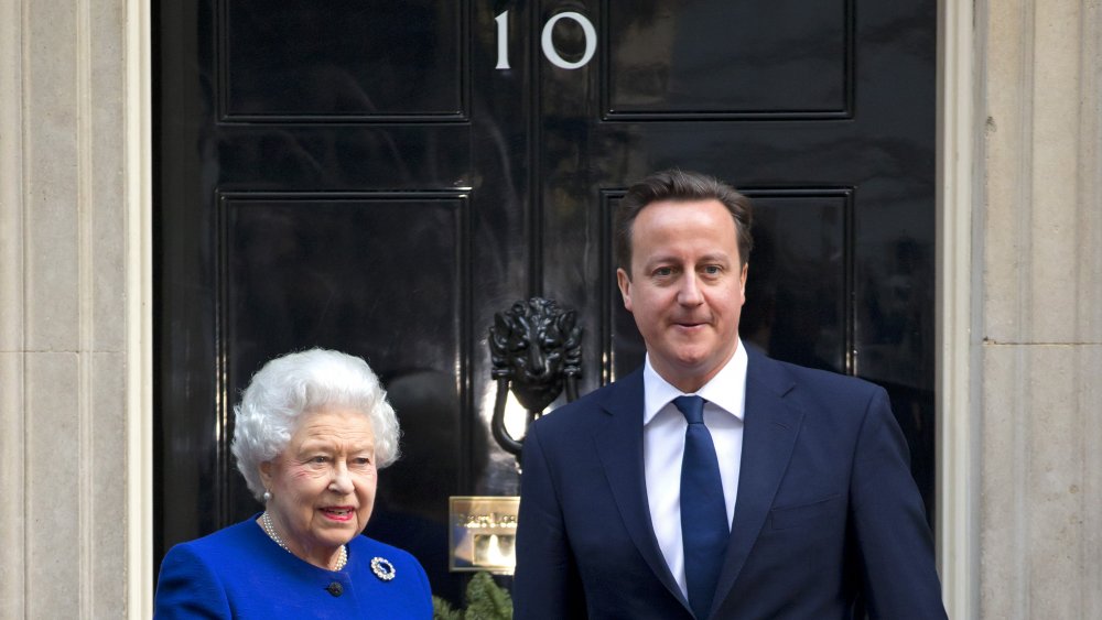 Queen Elizabeth outside of 10 Downing Street with a politician