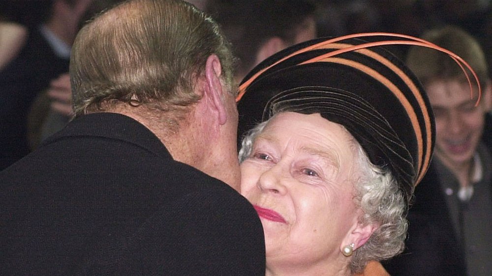 Queen Elizabeth and Prince Phillip embracing