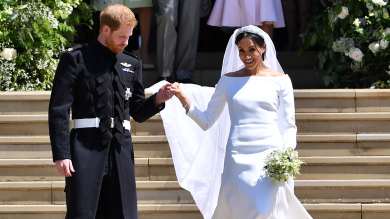 Prince Harry, Meghan Markle holding hands