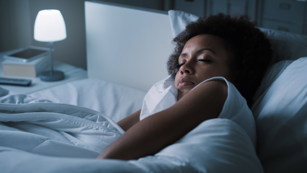 A woman asleep in bed