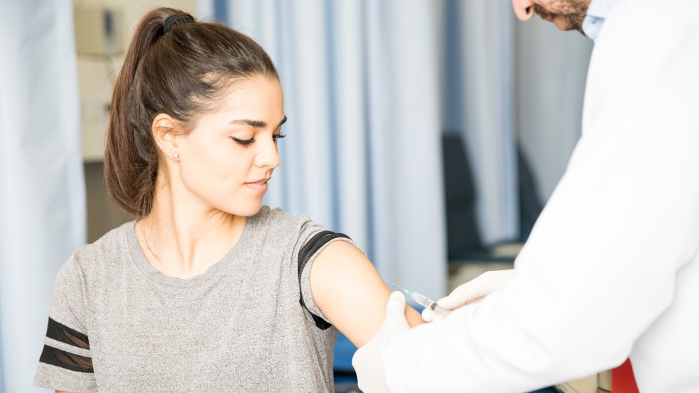 A woman getting vaccinated