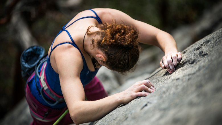 woman rock climbing