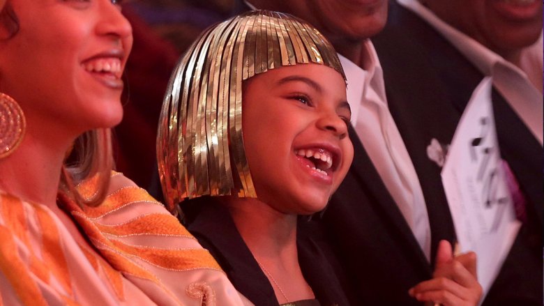 Blue Ivy bidding at an auction