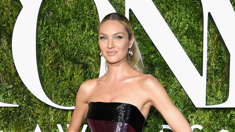 Candice Swanepoel poses at an event