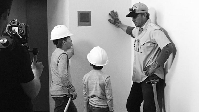 chip gaines and children construction helmets