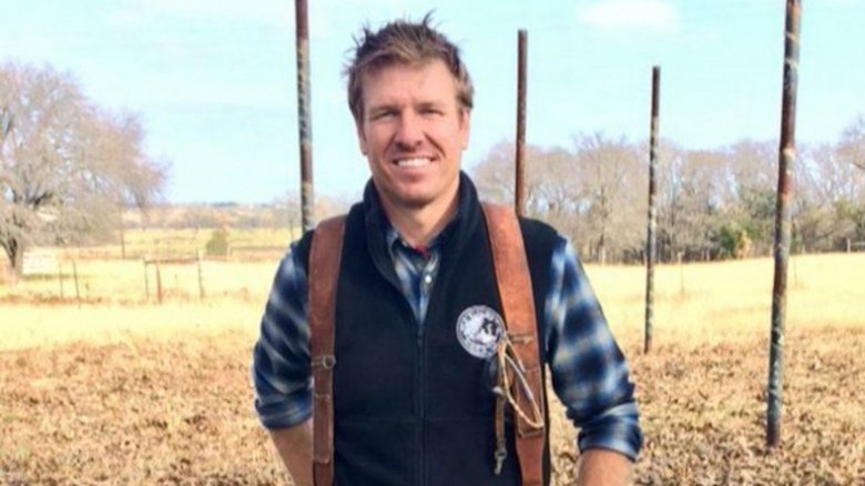 chip gaines smiling at camera outside