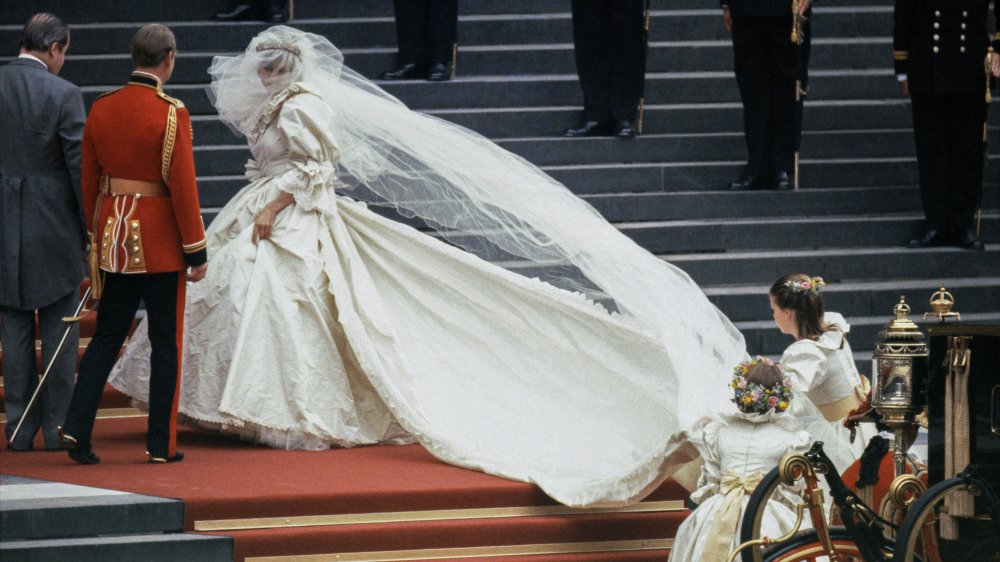 Princess Diana in her wedding outfit on the castle stairs