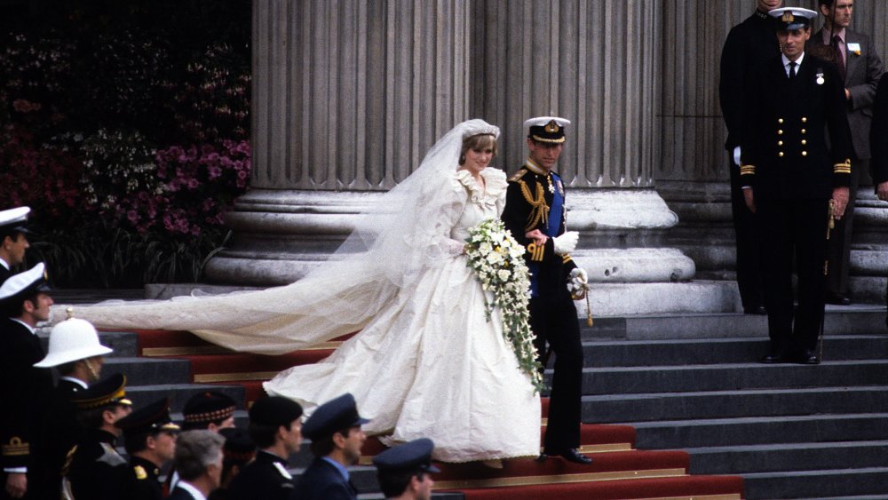 Princess Diana and Prince Charles descending stairs on their wedding day