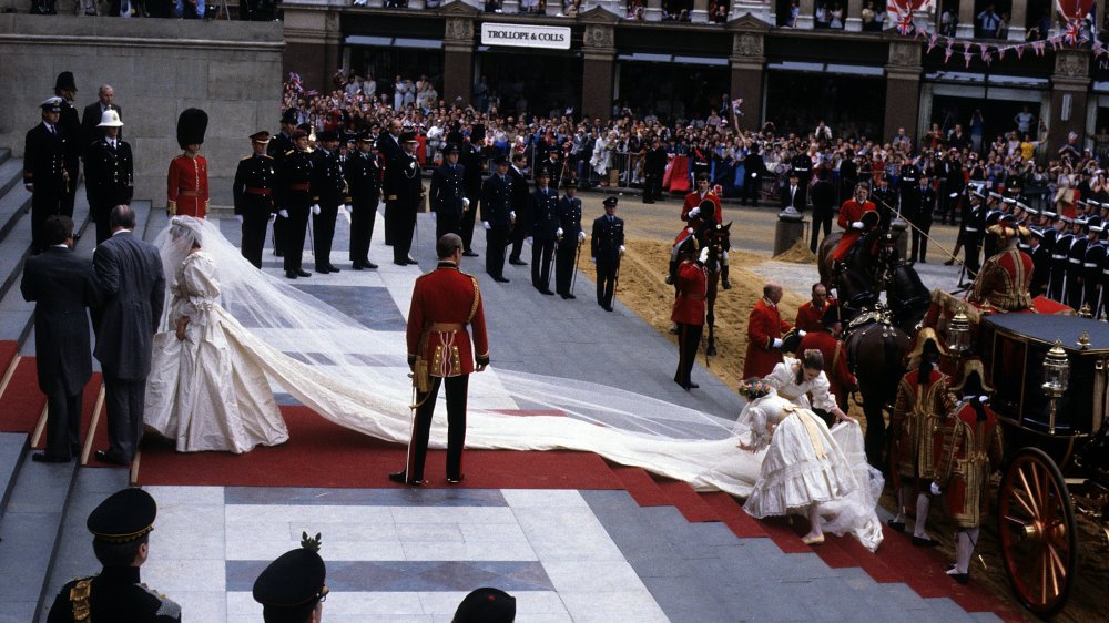 Princess Diana in her wedding outfit with the train fully extended