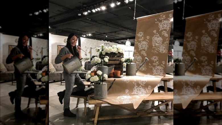 Joanna Gaines working on a display