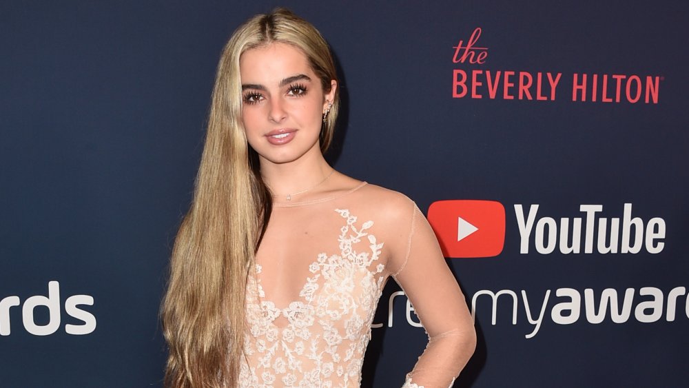 TikTok star Addison Rae on the red carpet wearing a lace dress