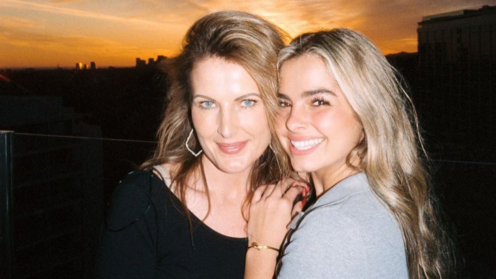 TikTok star Addison Rae with her mother in front of a sunset