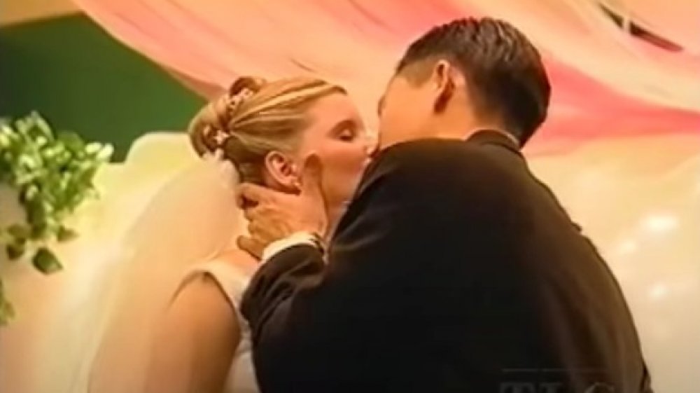 A couple smooching on TLC's Wedding Story