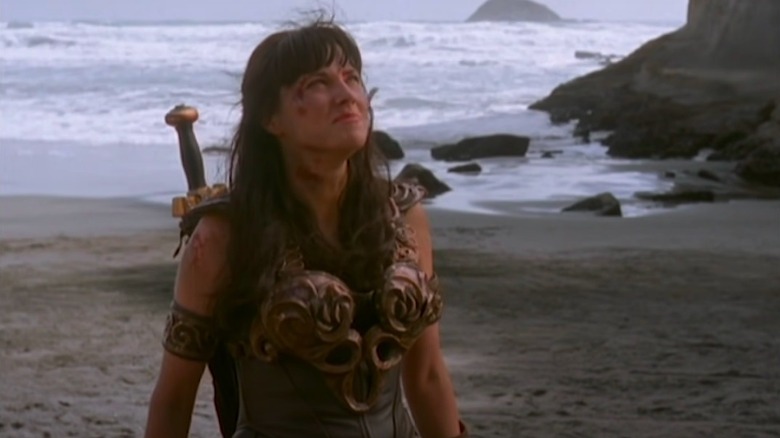 Lucy Lawless in Xena on a beach