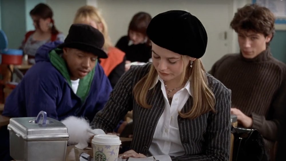 Alicia Silverstone as Cher in Clueless with a Starbucks cup