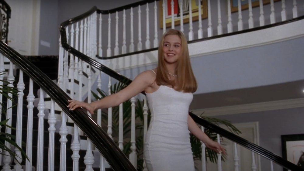 Alicia Silverstone as Cher from Clueless wearing a white dress