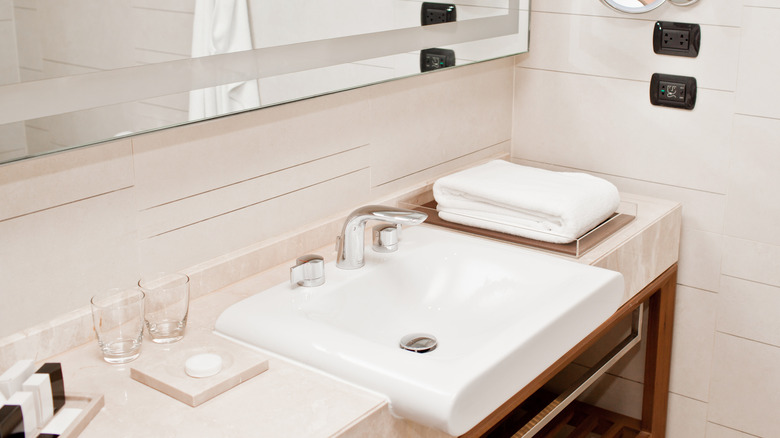 hotel room bathroom counter, something you should absolutely avoid touching