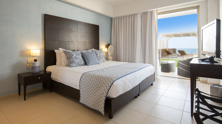 bed with headboard in hotel room