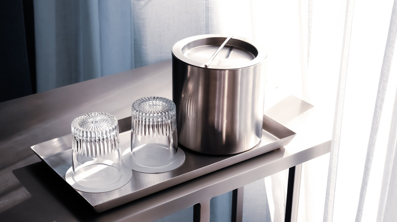 ice bucket with drinking glasses in hotel room, something you should absolutely avoid touching