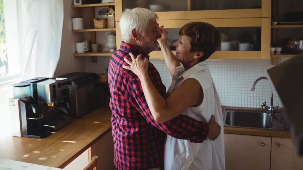 Couple dancing in kitchen