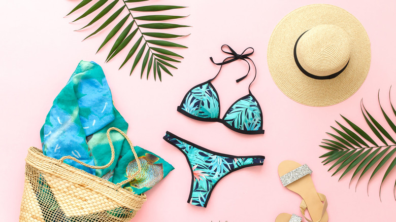 Beach gear with straw bag, bikini, hat and sandals