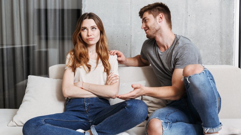 man trying to talk to woman