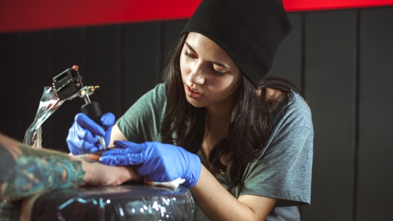 tattoo artist giving tattoo