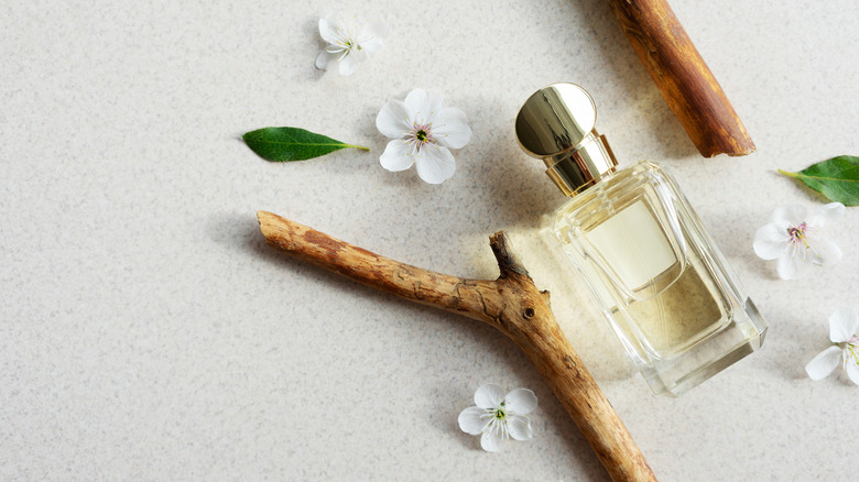 Perfume and flowers flat lay 